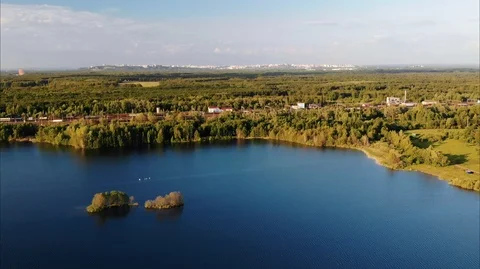The drone flies over the flooded quarry, next to which the railway is located Stock Footage 106926387