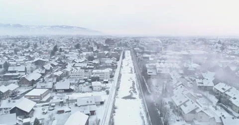A drone flies over a frozen river in winter Stock Footage 266891060