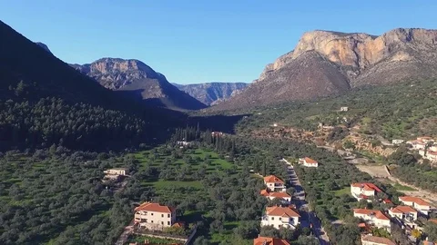 Drone flies over the gorge in the valley which is the Greek city of Leonidio. Stock Footage 72558314