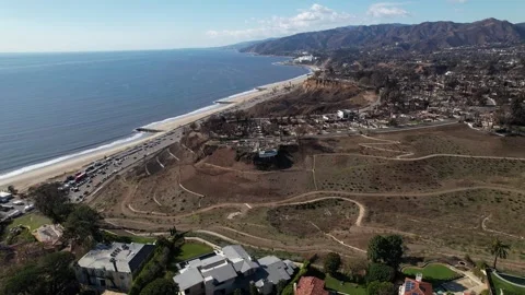Drone flies over Homes and Neighborhoods Burnt down from Palisades Fire 2025 Stock Footage 302700712