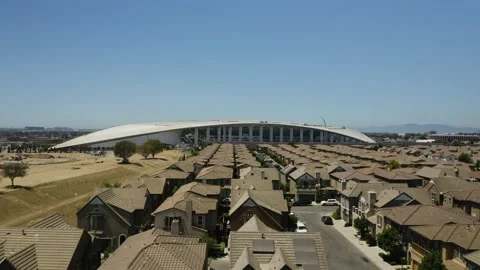 Drone Flies Over Homes towards SoFi Stadium, Inglewood Neighborhood of Los Stock Footage 138053193
