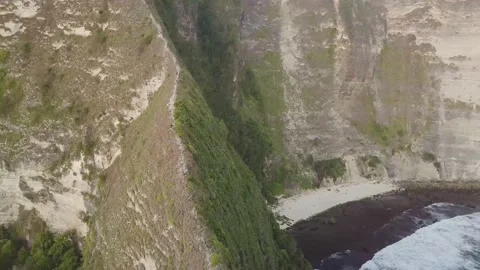 The drone flies over a huge mountain and sea in Indonesia. Video stock 155987458