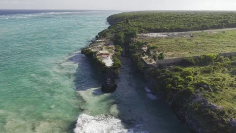 Drone flies over iconic staircase during high tide at Mtende Beach Stock Footage 344123199