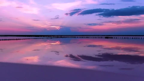 The drone flies over the lake in which the sunset is reflected Stock Footage 146241382