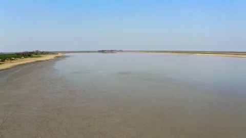 Drone flies over large dried up lake in summer in nature reserve Slano Kopovo Video stock 270501944