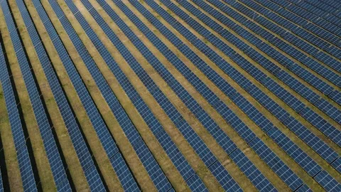 Drone flies over a large field with solar panels. 4k footage. collecting energy Stock Footage 163753306