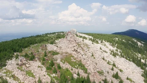 A drone flies over marble cliffs at the top of a mountain range. Stock Footage 114057152