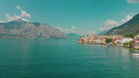 Drone flies over medieval town malcesine with tower on lake garda 스톡 동영상 247449954