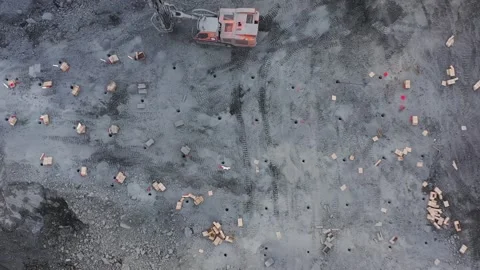 Drone flies over a mined stone quarry explosive holes are visible Stock Footage 236400970