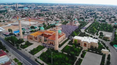 A drone flies over the mosque complex during prayers. Believers pray in the Stock Footage 310715522