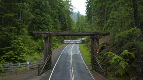 Drone Flies Over Mount Rainier National Park Welcome Sign on Cool Damp Morning Stock Footage 133479378