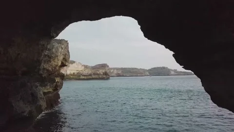 The drone flies over the mountain and takes pictures of the sea. Stock Footage 155987629