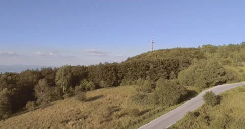 Drone flies over the mountain and shows big city view Video stock 237633445