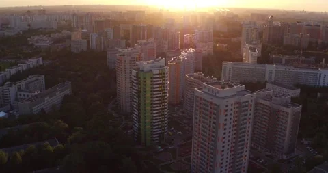 Drone flies over a new modern residential complex in Moscow at sunset Stock Footage 241020643