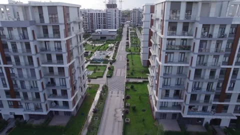 A drone flies over newly built high-rise buildings Stock Footage 250407522
