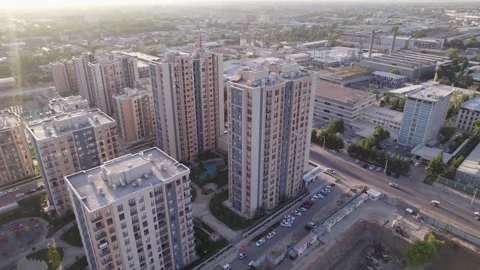 A drone flies over newly built high-rise buildings Stock Footage 250408791