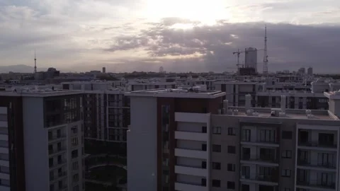A drone flies over newly built high-rise buildings Stock Footage 253467988