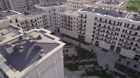 A drone flies over newly built high-rise buildings Stock Footage 256125135
