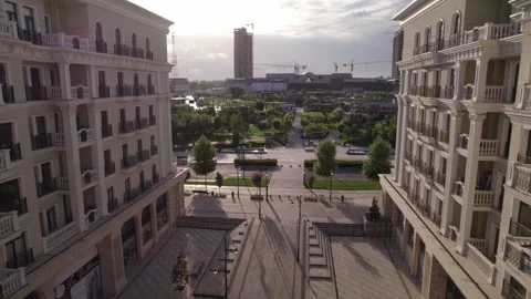 A drone flies over newly built high-rise buildings Stock Footage 258093030