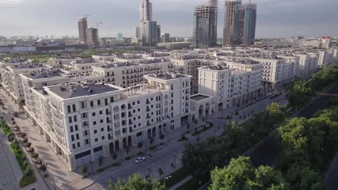 A drone flies over newly built high-rise buildings Stock Footage 263437685
