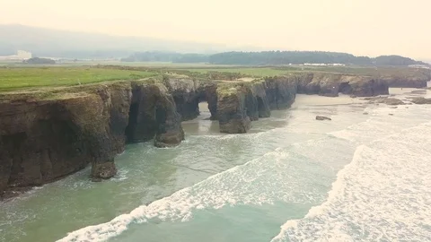 Drone flies over the ocean and rocks Stock Footage 81551416