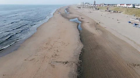 Drone flies over ocean beach in the city on a summer day Vídeo Stock 196836626