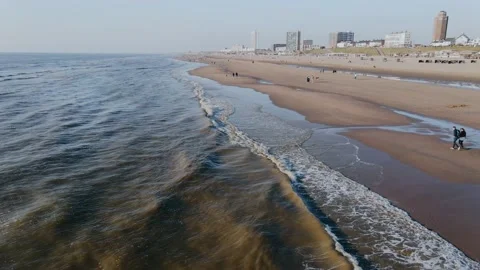 Drone flies over ocean beach in the city on a summer day Video stock 196836824