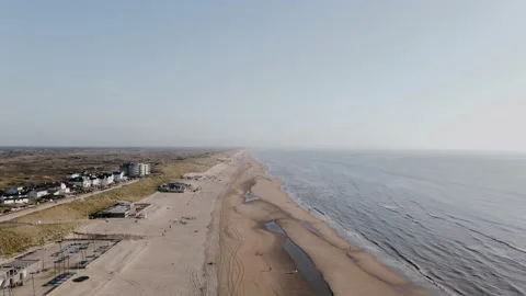 Drone flies over ocean beach outside the city on a summer day Stock-Footage 196836946