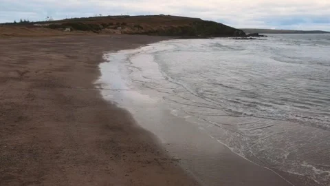 Drone flies over the ocean beach in cloudy weather, Ireland Stock Footage 267076231