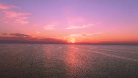 Drone flies over the ocean at sunset Stock Footage 146322803