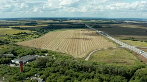 Drone flies over a plowed field Stock Footage 159874652