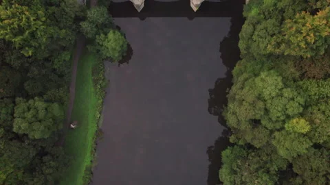 Drone flies over Prebends Bridge in Durham looking directly down Stock Footage 276417835