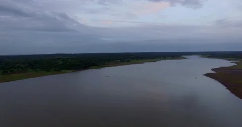 The Drone flies over a river at dawn in Africa. Aerial video. Stock Footage 67457158