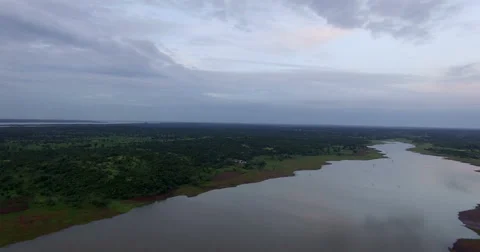 The Drone flies over a river at dawn in Africa, Mali. Aerial video. Stock Footage 67464972