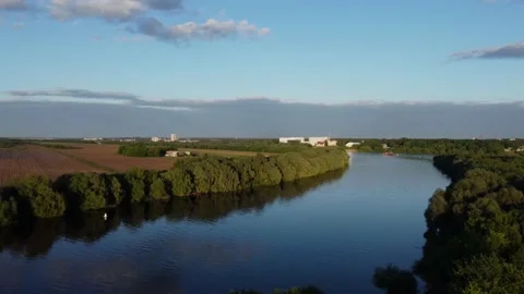 The drone flies over the river to the field  Stock-Footage 155884642