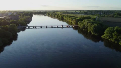The drone flies over the river to the floating bridge  Stock-Footage 155884656