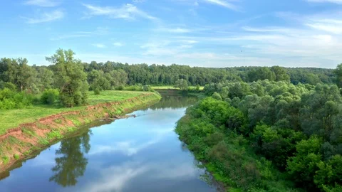 The drone flies over the river Stock Footage 116691079