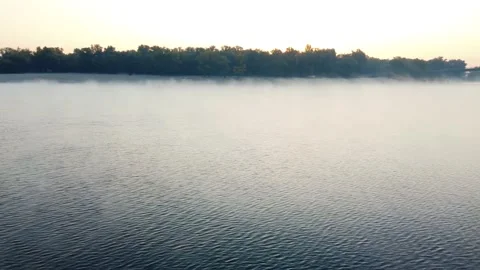 Drone flies over the river, haze and fog.  Stock Footage 185538734