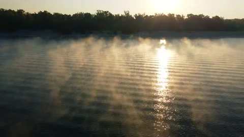 Drone flies over the river, haze and fog. pedestrian bridge Stock Footage 186069839