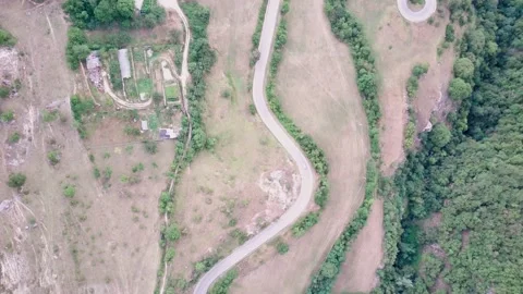 Drone flies over the road in the mountains Stock Footage 150462985