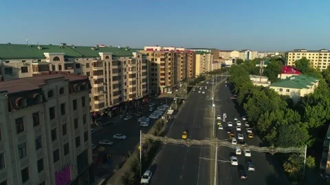 The drone flies over the roads and highways of the city with moving cars Stock Footage 258247046
