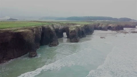 Drone flies over the rocks in the ocean Stockbeeldmateriaal 87205138