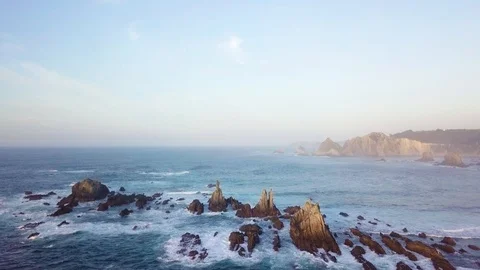Drone flies over the rocks in the ocean Stockbeeldmateriaal 87205204