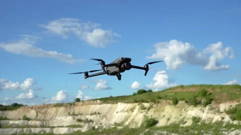 A drone flies over a sand pit. Modern technologies for geological exploration Stock Footage 312899370