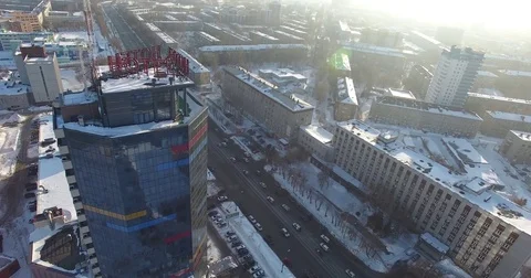 Drone flies over the skyscraper. The snow on the roof of a skyscraper. Stock Footage 77161731
