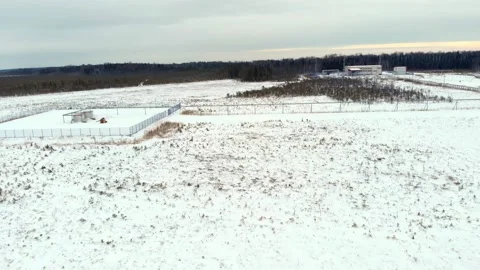 A drone flies over a snow-covered area in the northern part of the country in an Stock Footage 166662998