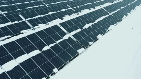 A drone flies over the solar panels. Renewable green energy Stock Footage 232696376