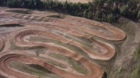 The drone flies over the stadium with riding motorcycles. Drone flies over motoc Stock Footage 242807682