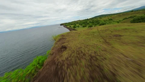 The drone flies over the steep shore of the ocean Stock Footage 253480028
