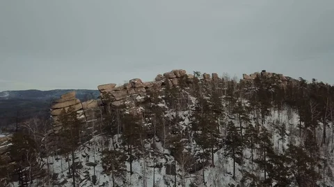 Drone flies over stone comb in winter mainly cloudy Stock Footage 101374018